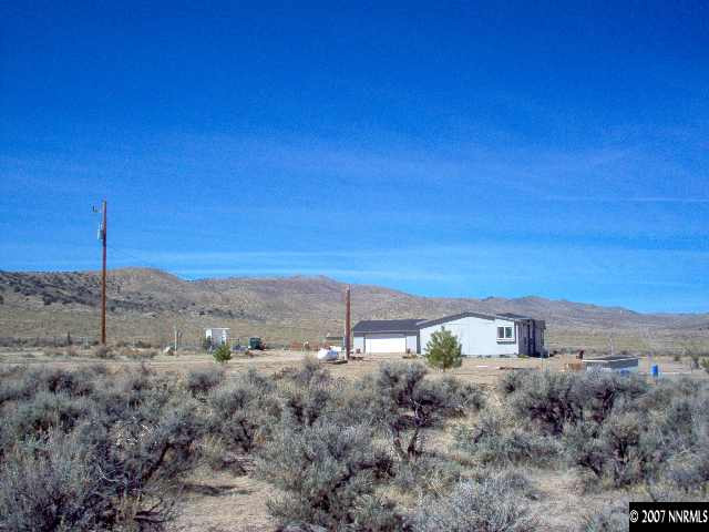 6805 Winnemucca Ranch Road Reno, NV 89510 - Photo 9 of 9 a view of a dry yard with trees