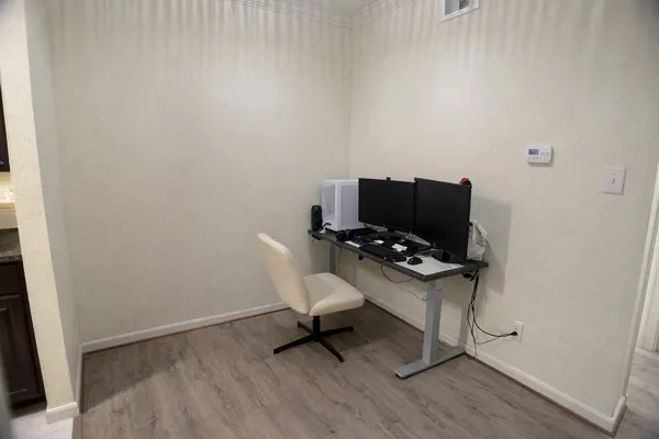 a view of workspace with wooden floor