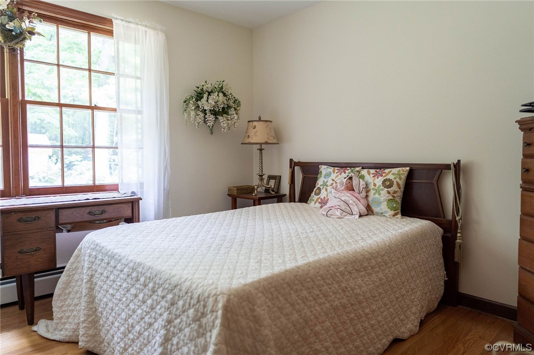 12808 South Chester Road Chester, VA 23831 - Photo 16 of 32 a bedroom with a bed and a window
