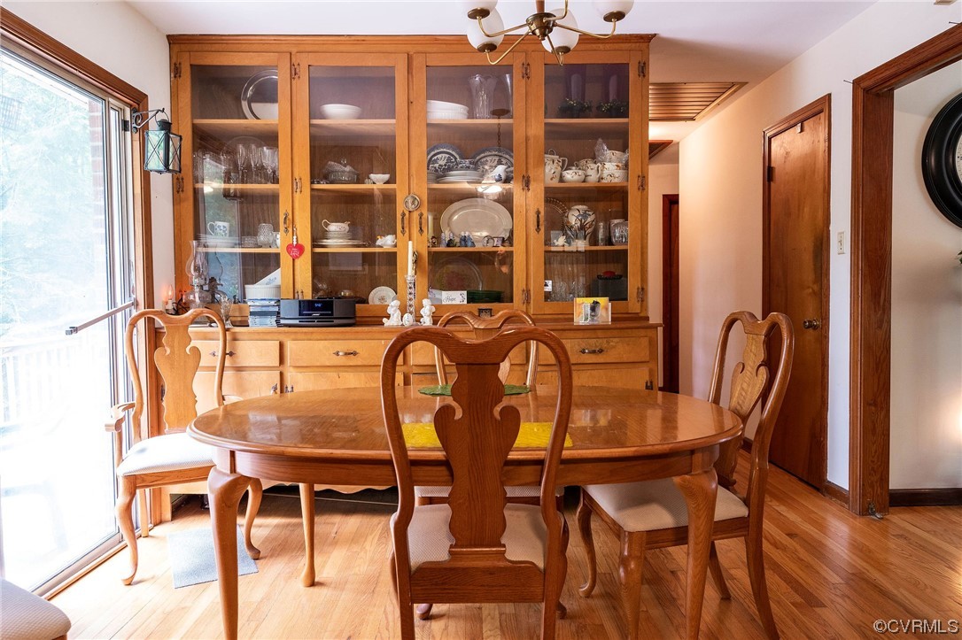 12808 South Chester Road Chester, VA 23831 - Photo 6 of 32 a view of a dining room with furniture and chandelier