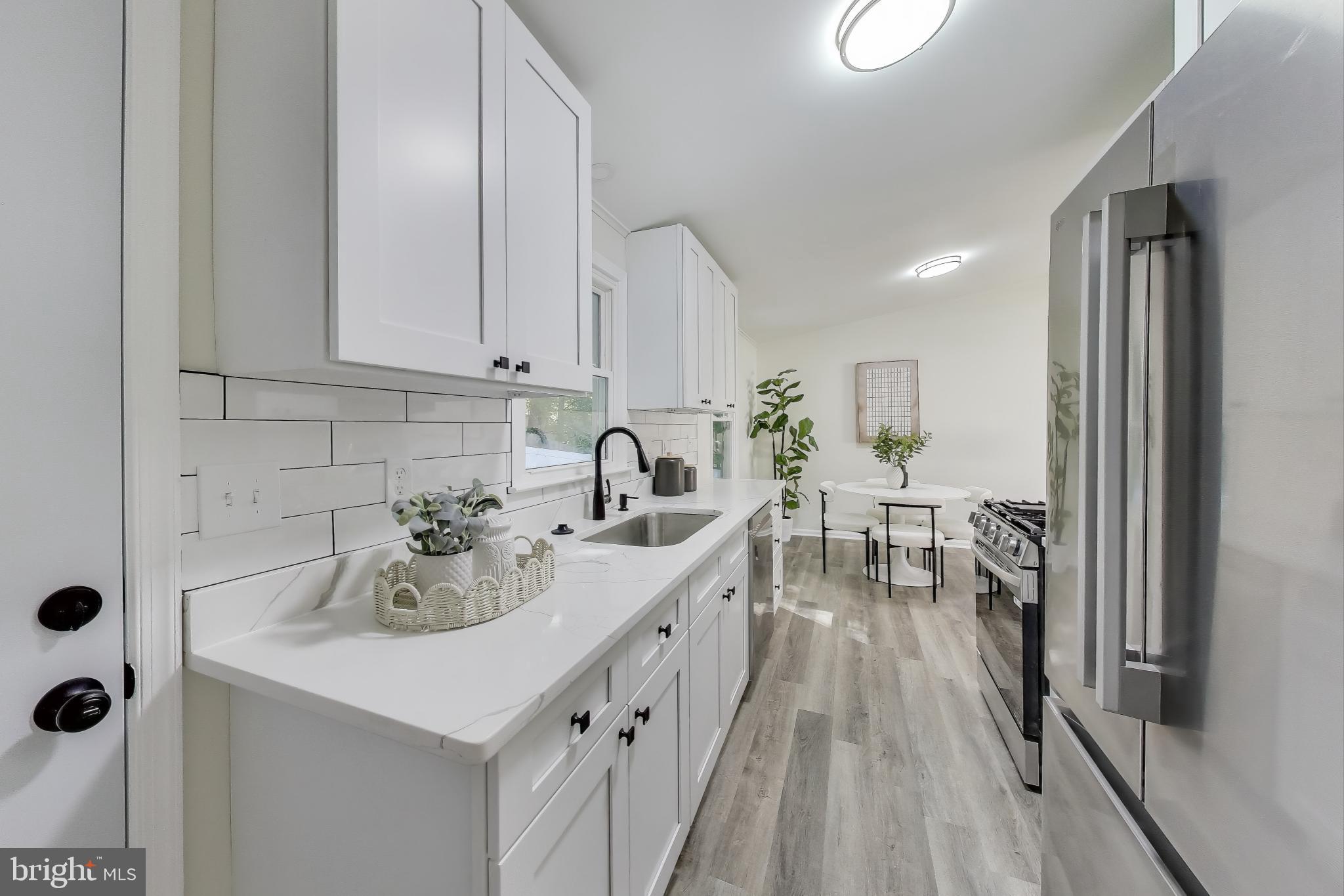 18905 Red Oak Lane Triangle, VA 22172 - Photo 11 of 38 a view of a kitchen with a sink and microwave