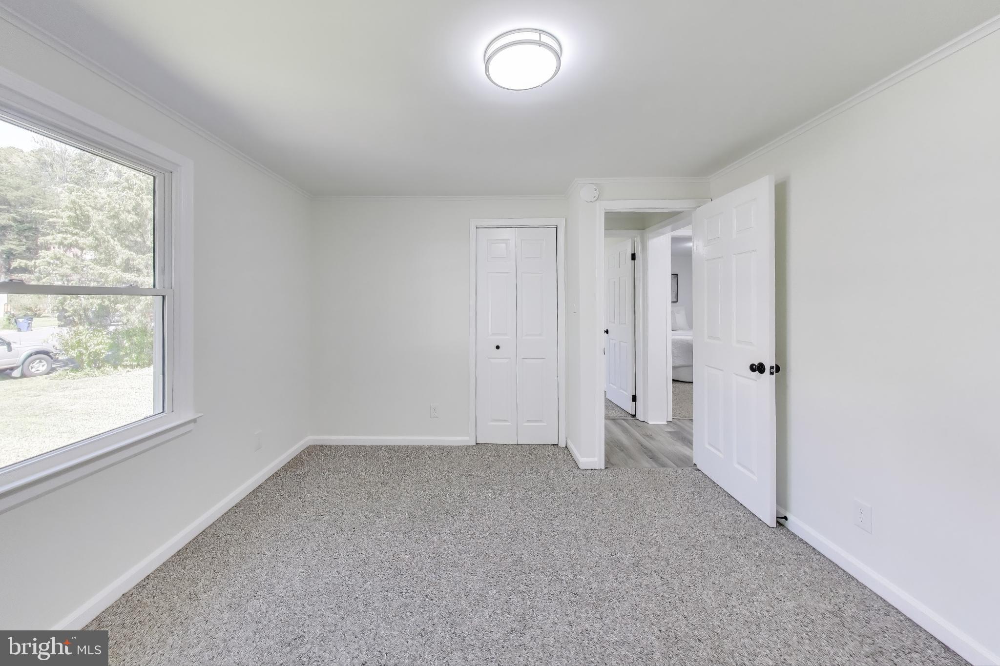 18905 Red Oak Lane Triangle, VA 22172 - Photo 13 of 38 a view of an empty room with a window