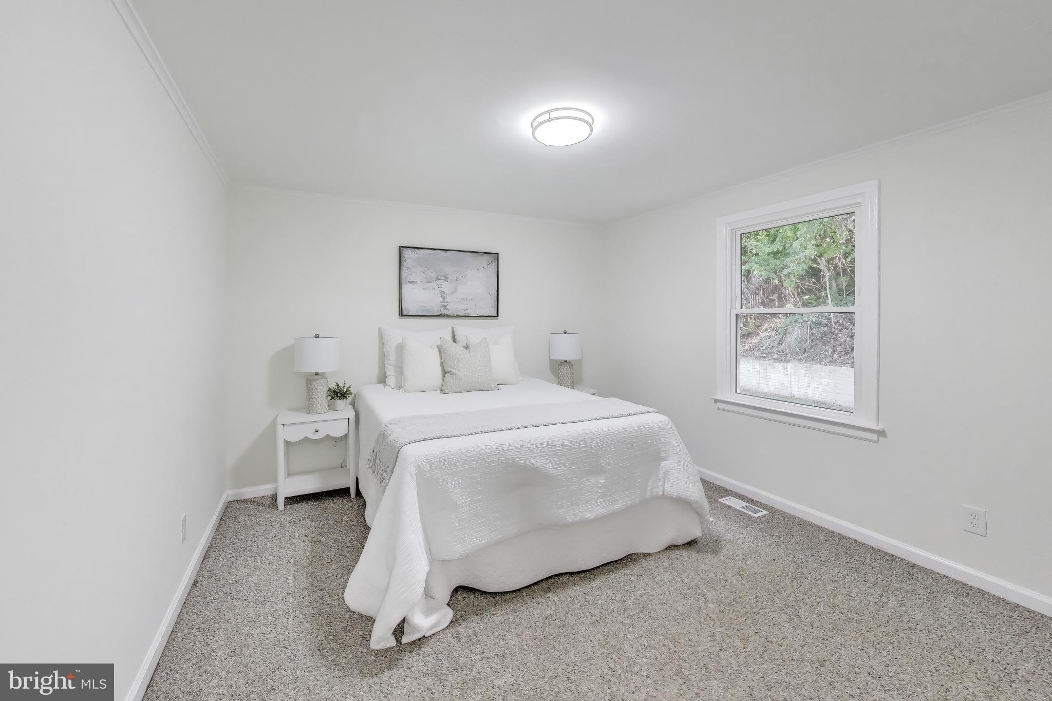 18905 Red Oak Lane Triangle, VA 22172 - Photo 14 of 38 a bedroom with a bed and window