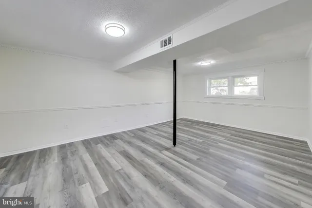 a view of an empty room and window