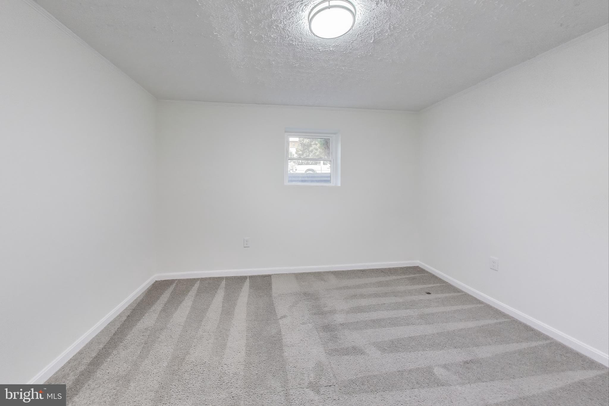 18905 Red Oak Lane Triangle, VA 22172 - Photo 22 of 38 a view of a room with wooden floor and white walls