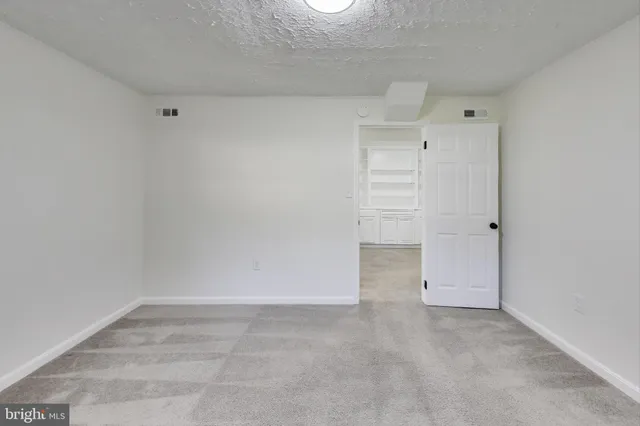 a bathroom with a bathtub shower sink mirror vanity and toilet