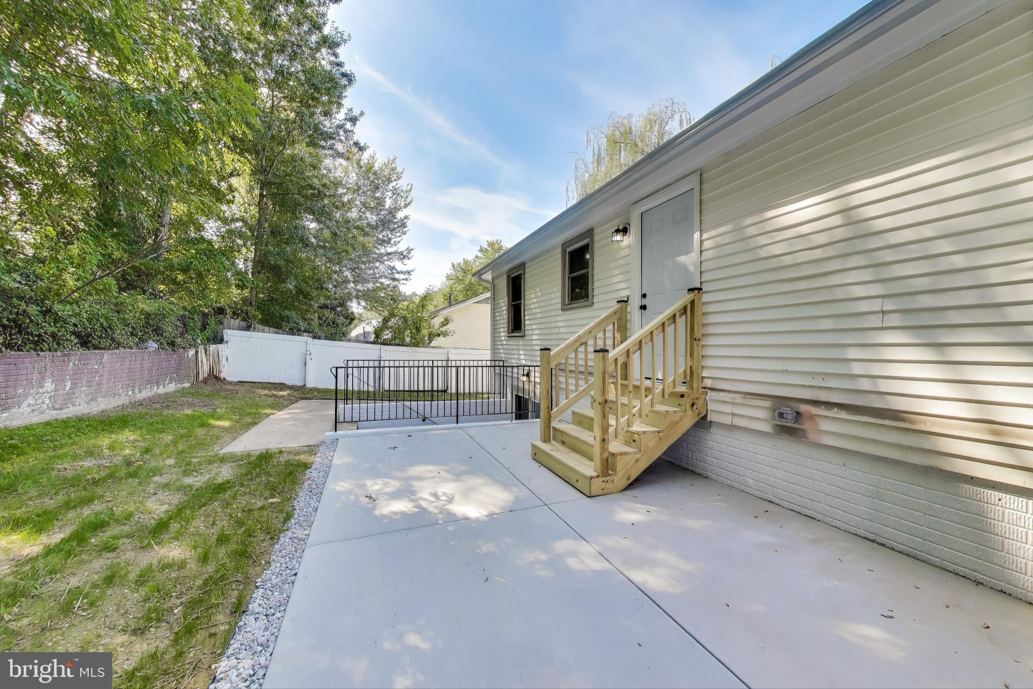 18905 Red Oak Lane Triangle, VA 22172 - Photo 33 of 38 a view of a house with a yard