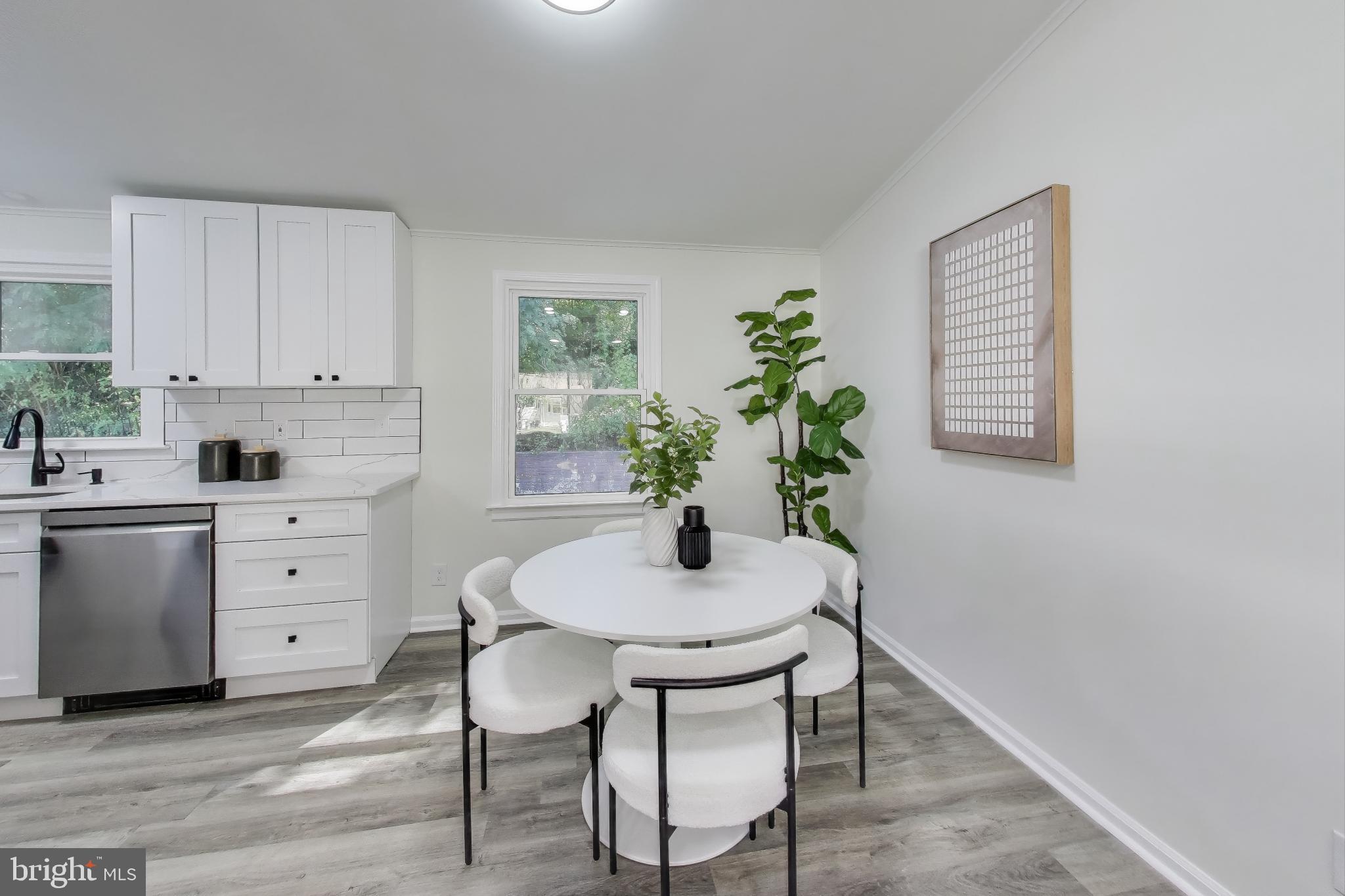18905 Red Oak Lane Triangle, VA 22172 - Photo 7 of 38 a kitchen with a white table and chairs