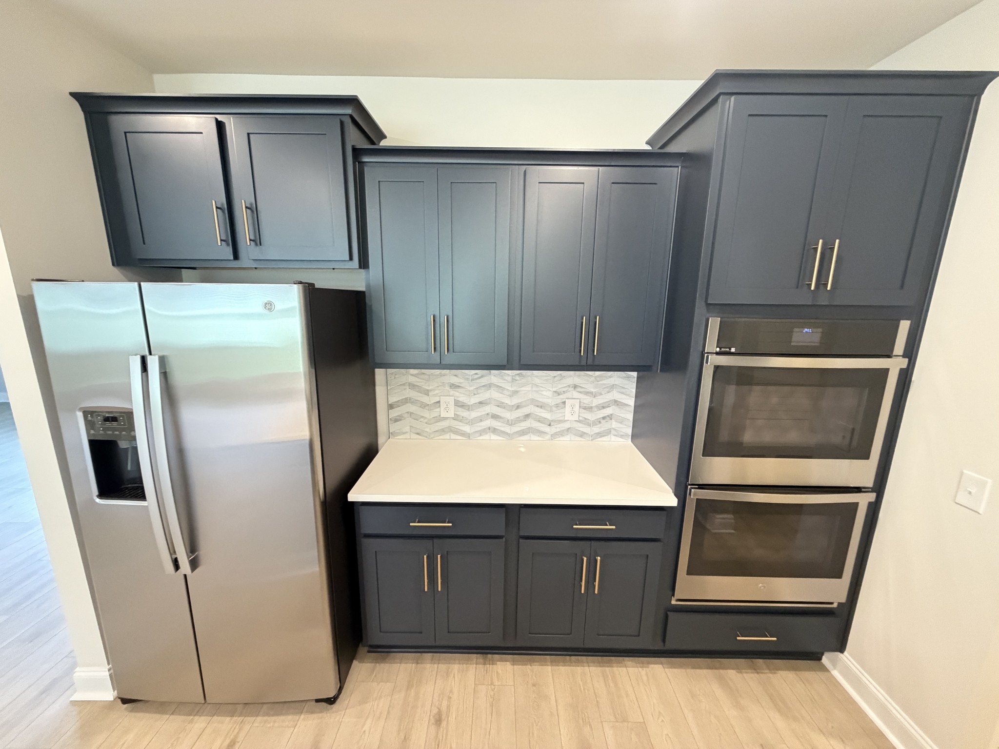147 Emeline Way Mount Juliet, TN 37122 - Photo 9 of 41 a kitchen with wooden cabinets and refrigerator