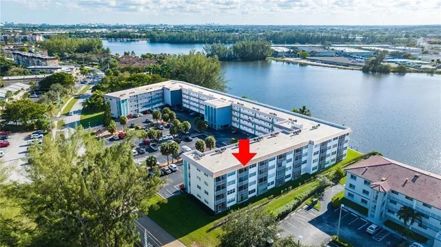 an aerial view of a house with a lake view