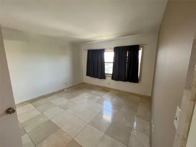 a view of a room with large windows