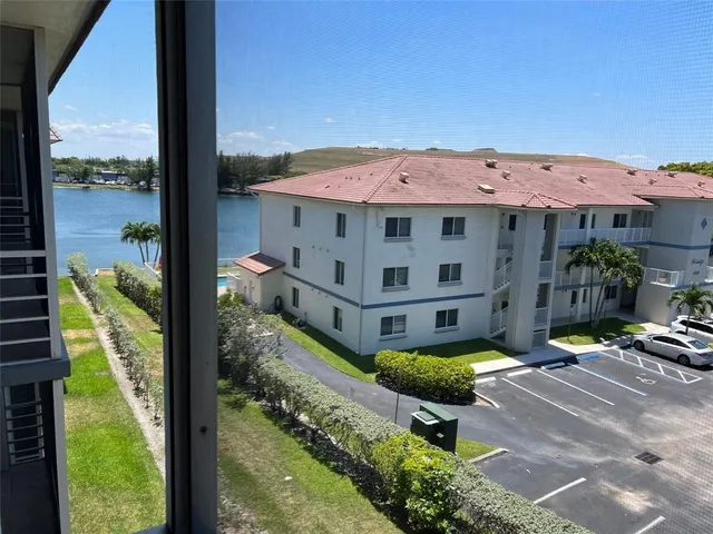 a view of a patio with a table and chairs
