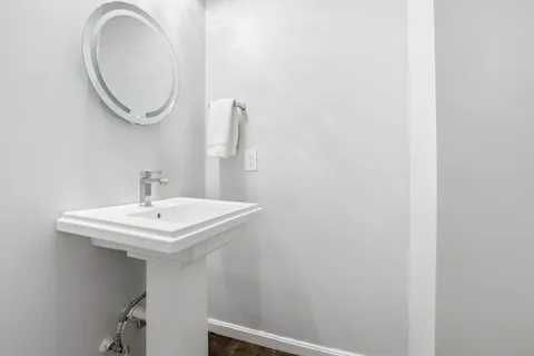 a bathroom with a sink and a mirror