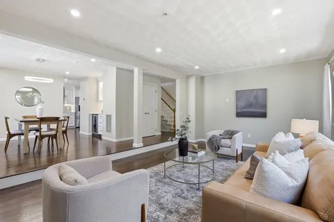 a living room with furniture and a table