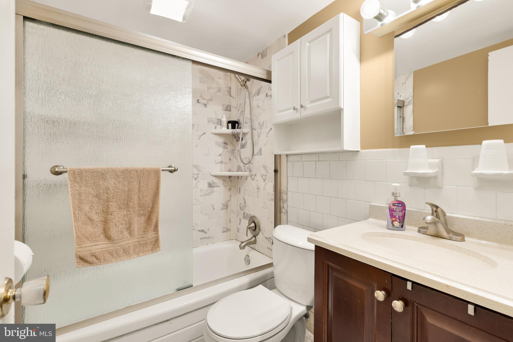 3313 Claridge Court Silver Spring, MD 20902 - Photo 16 of 23 a bathroom with a sink toilet and shower