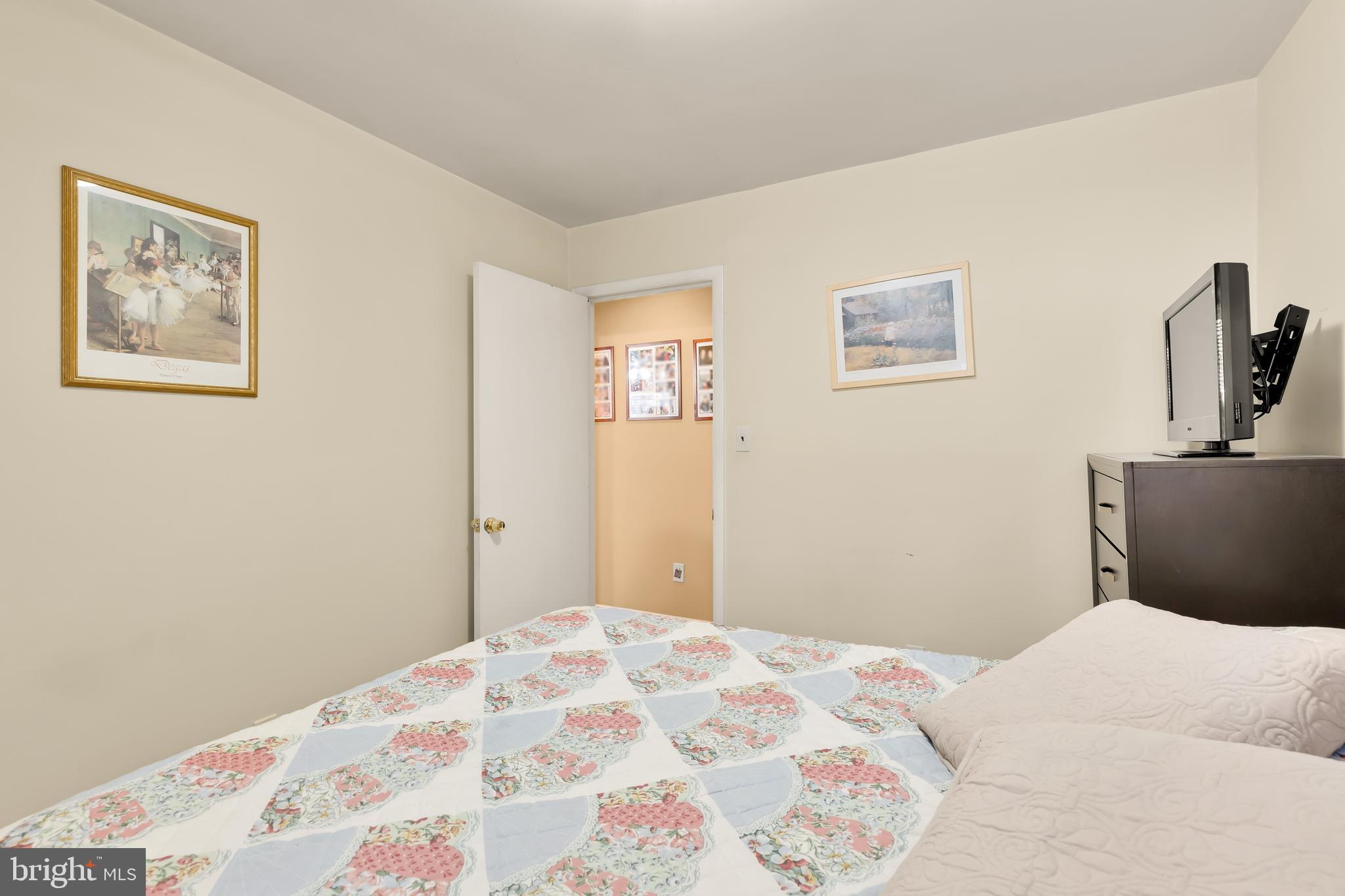 3313 Claridge Court Silver Spring, MD 20902 - Photo 20 of 23 a bedroom with bed and wooden floor
