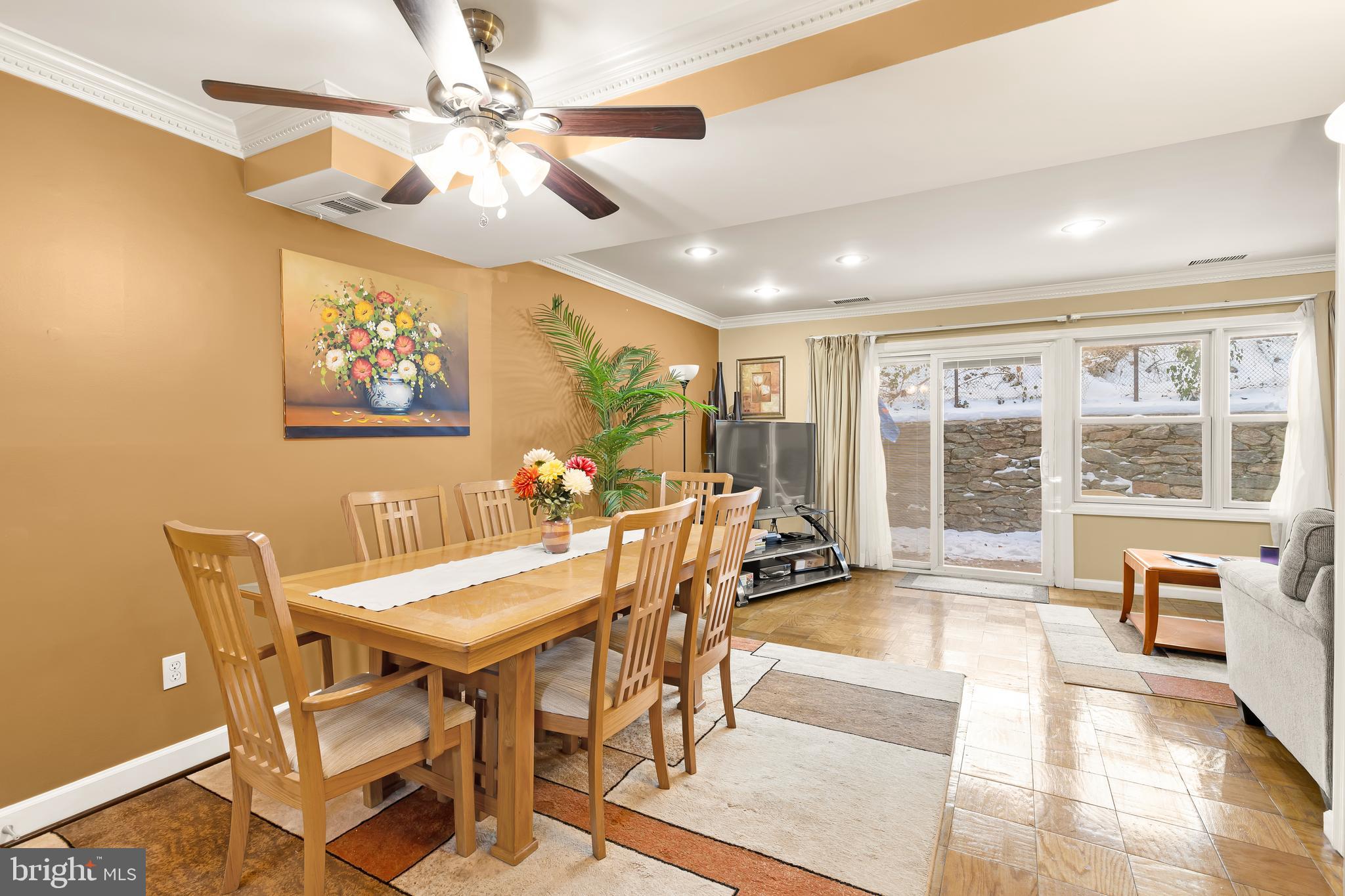 3313 Claridge Court Silver Spring, MD 20902 - Photo 4 of 23 a view of a dining room with furniture large outside view and wooden floor