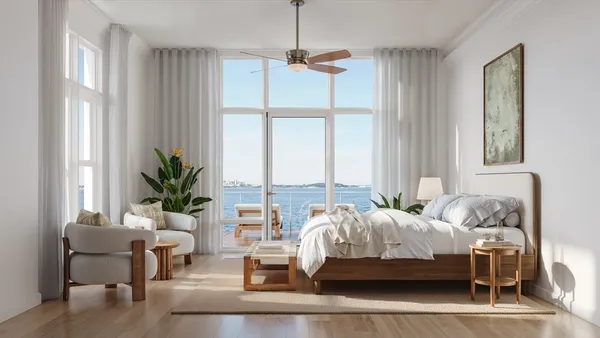 a bedroom with bed and a window