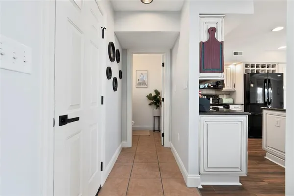 a view of a kitchen from the hallway