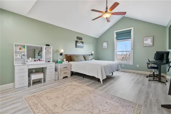 a bedroom with a bed and a fireplace