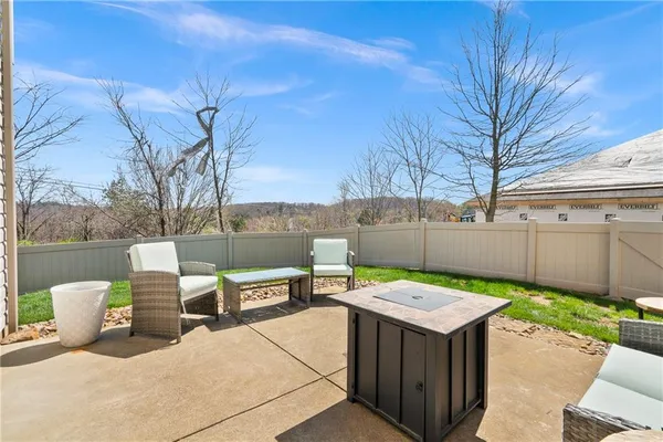 a view of a backyard with sitting area