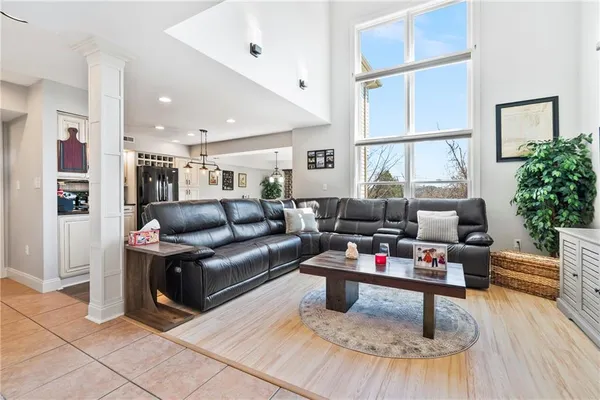 a living room with furniture and a potted plant