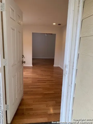 a view of room with wooden floor