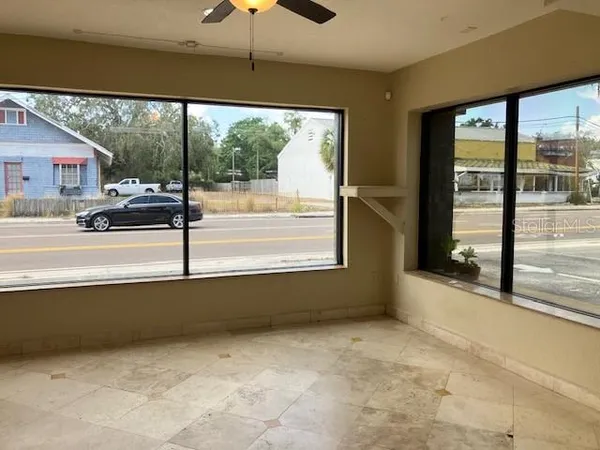a view of an empty room with a window