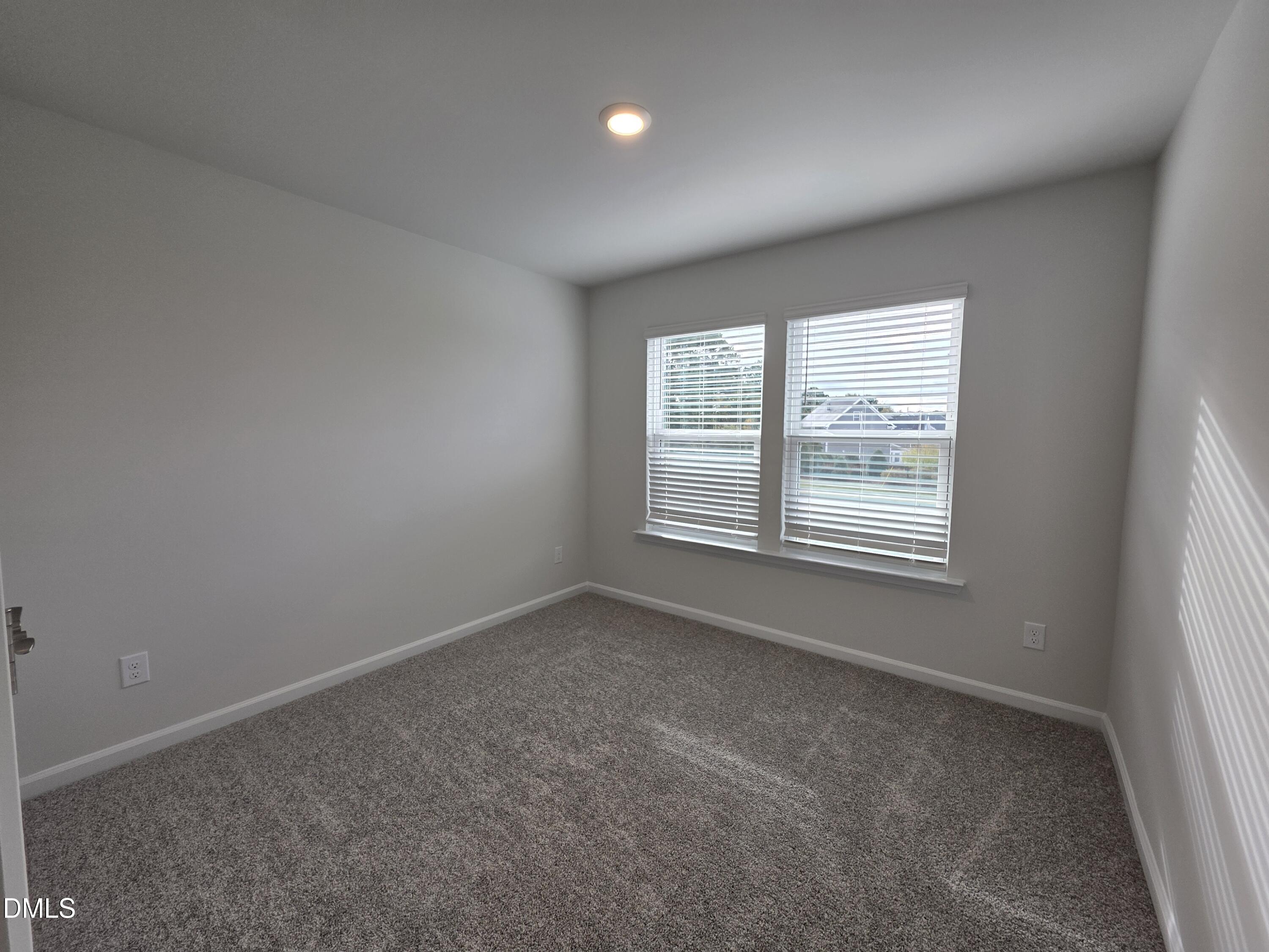 2540 Olive Chapel Road Apex, NC 27502 - Photo 13 of 27 an empty room with windows and closet