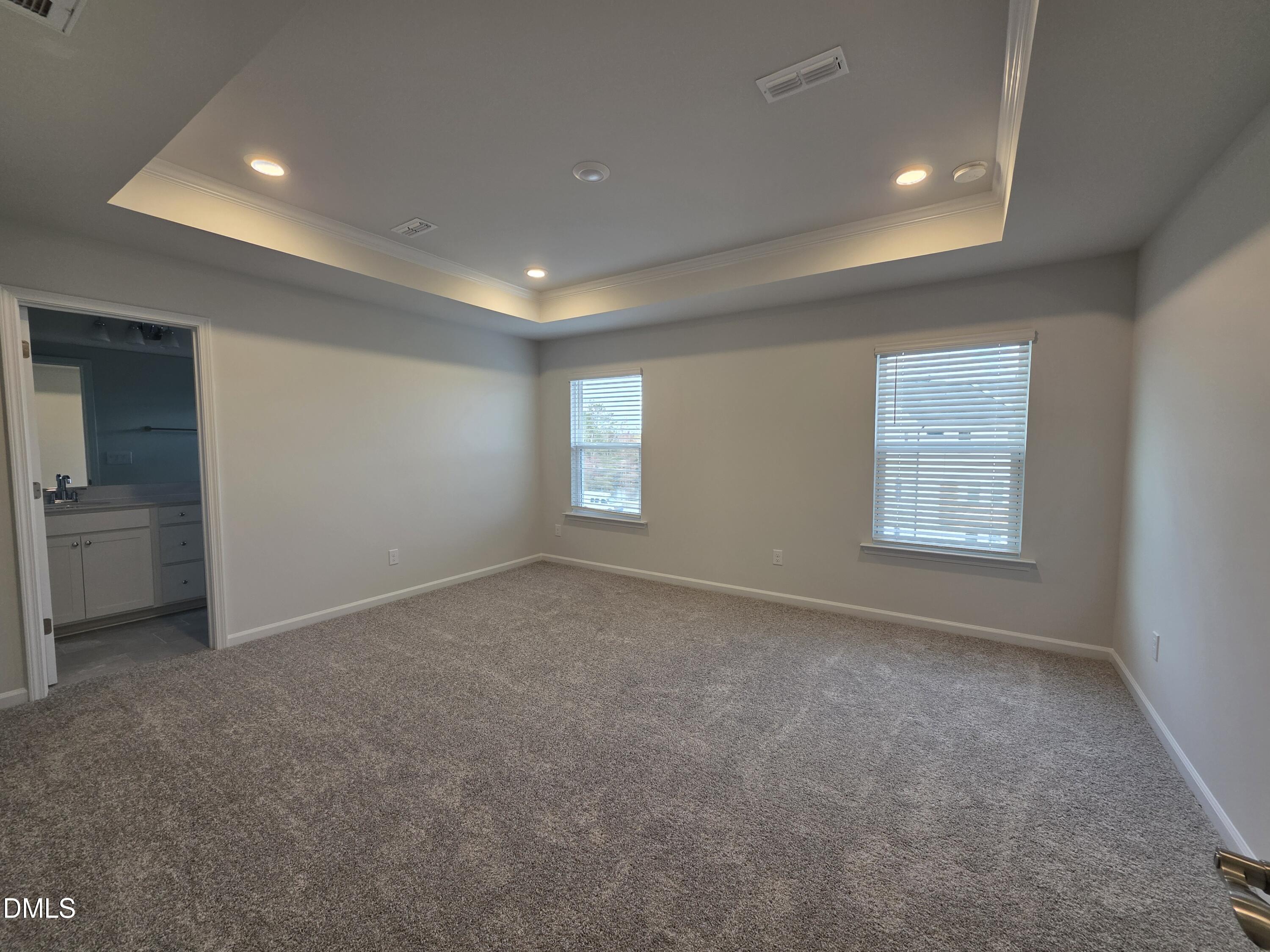 2540 Olive Chapel Road Apex, NC 27502 - Photo 17 of 27 an empty room with windows and closet