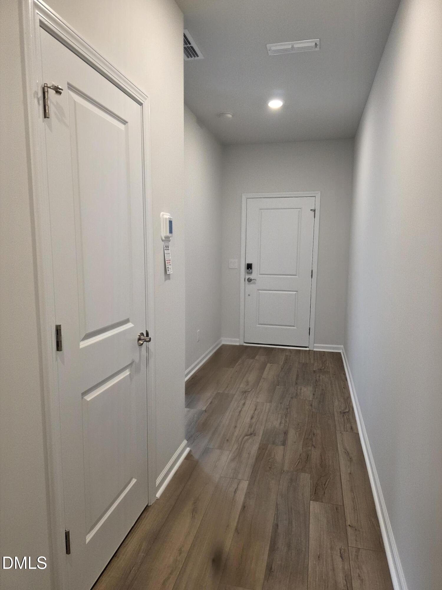 2540 Olive Chapel Road Apex, NC 27502 - Photo 2 of 27 a view of a hallway with wooden floor