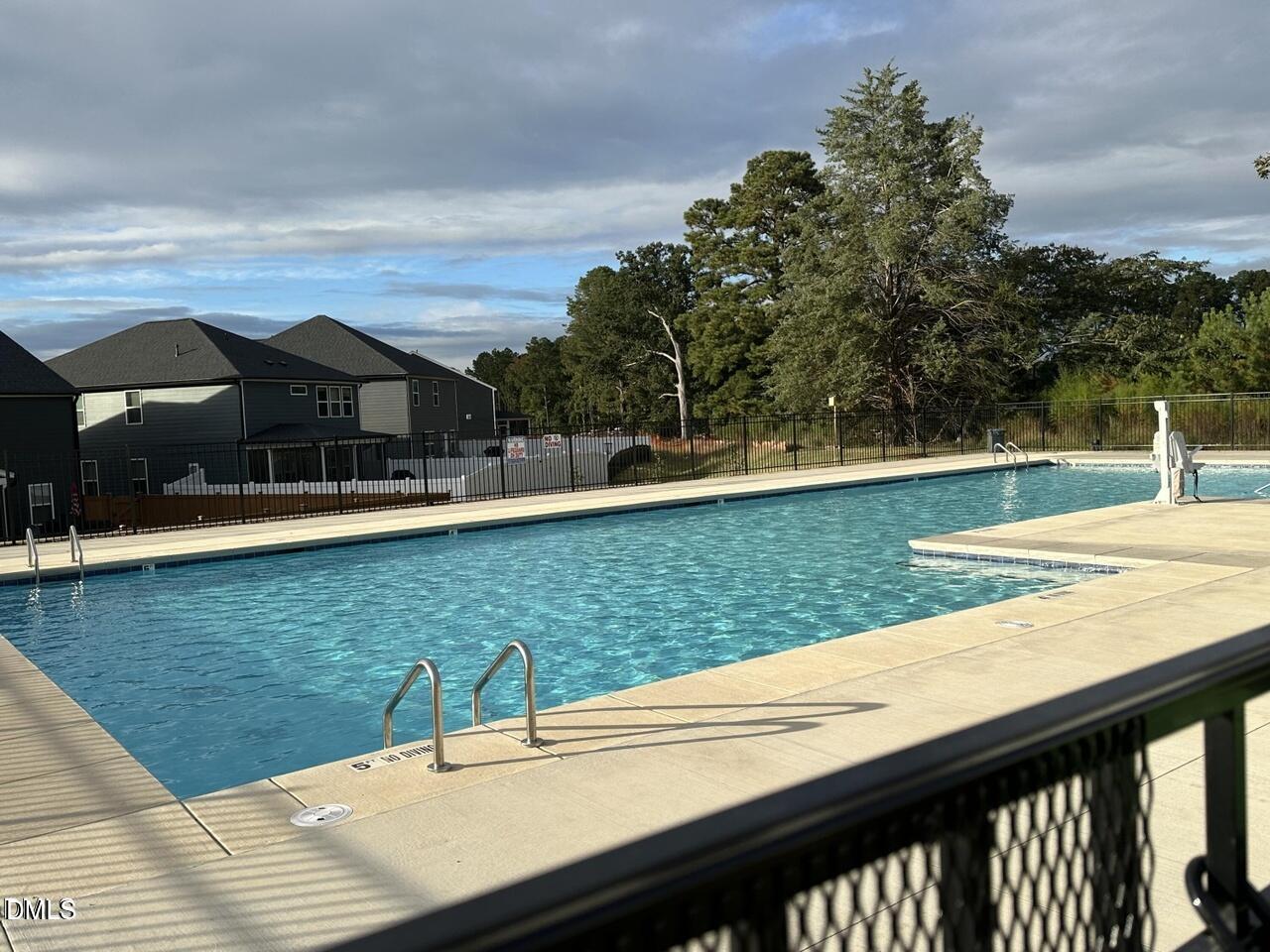 2540 Olive Chapel Road Apex, NC 27502 - Photo 25 of 27 a view of a swimming pool with a yard
