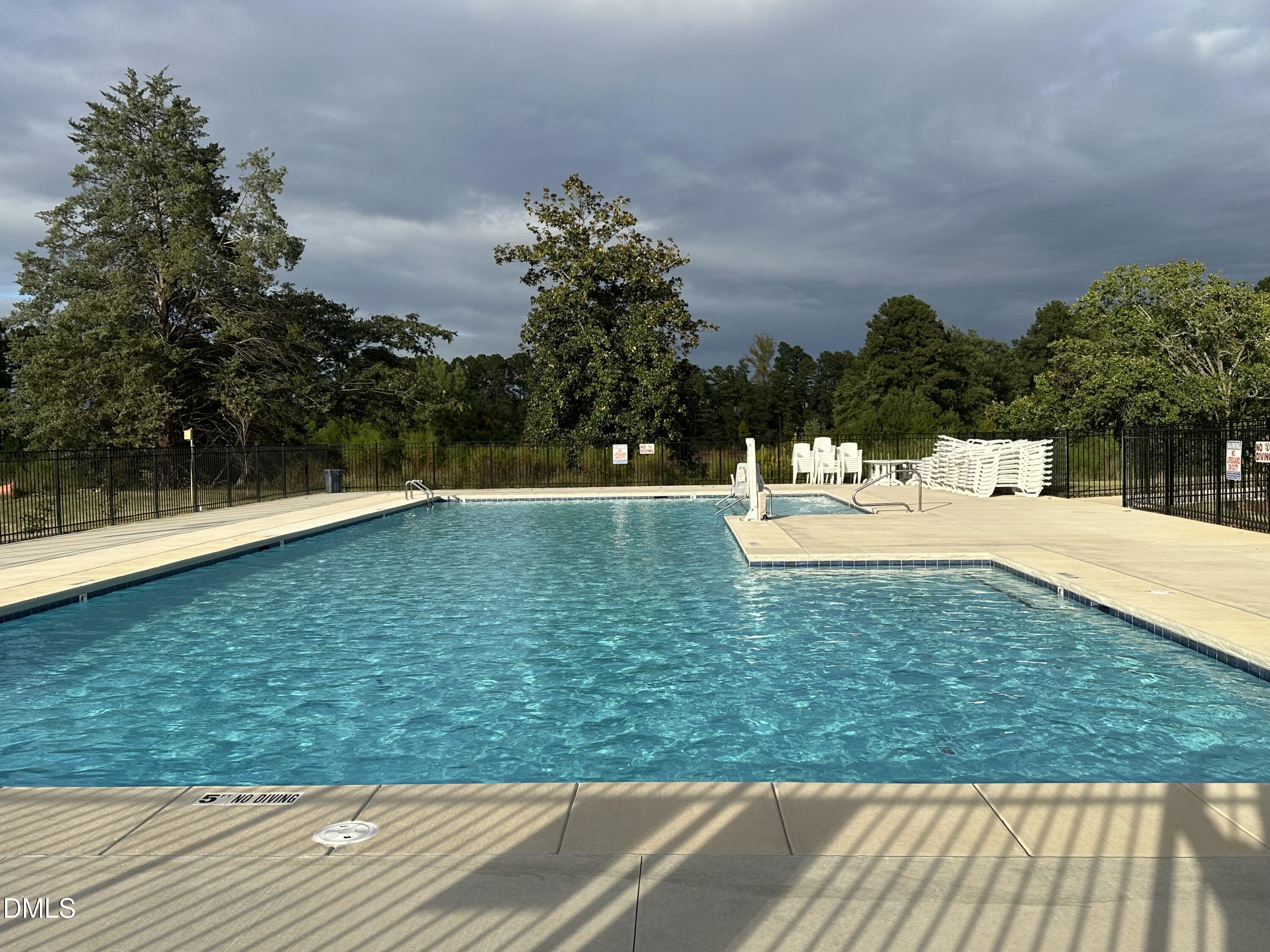 2540 Olive Chapel Road Apex, NC 27502 - Photo 26 of 27 a view of swimming pool with a yard