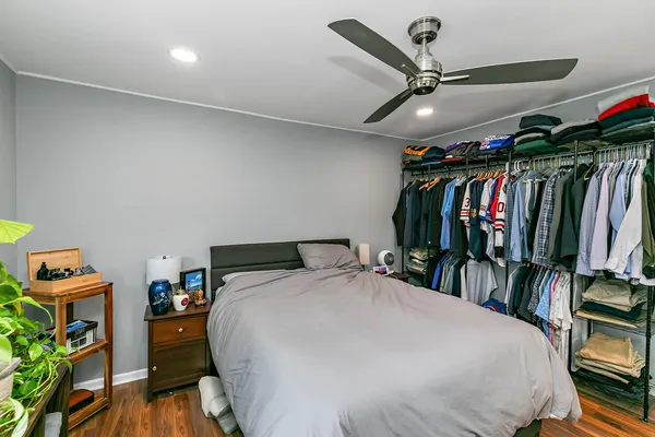 a bed room with a bed and a walk in closet