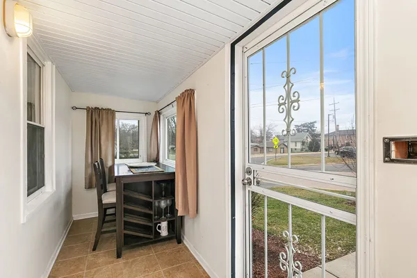 a view of work space with wooden floor and furniture