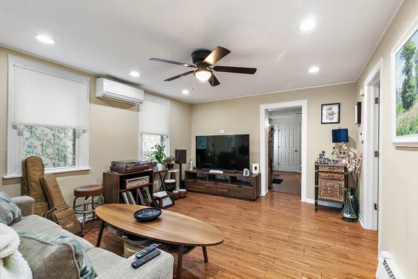 a living room with furniture and a flat screen tv