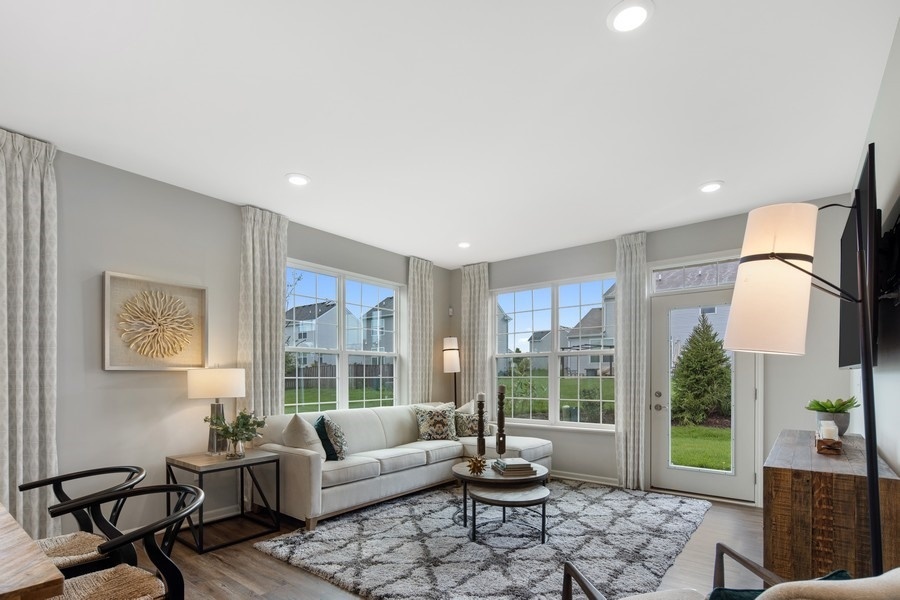 25612 West Springview Drive Plainfield, IL 60586 - Photo 8 of 23 a living room with furniture and a large window