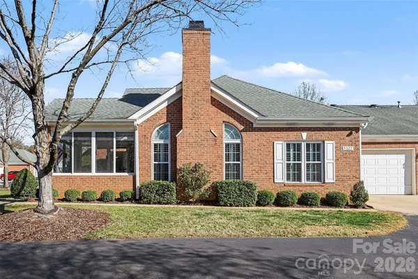 a front view of a house with a yard and porch