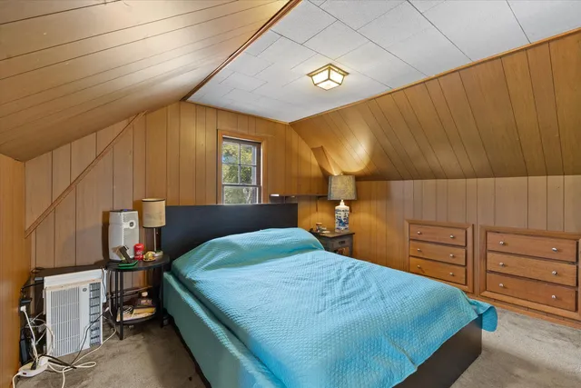 a bedroom with a bed and furniture