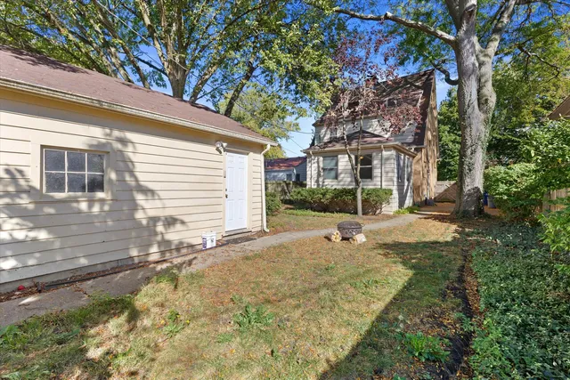a view of house with yard