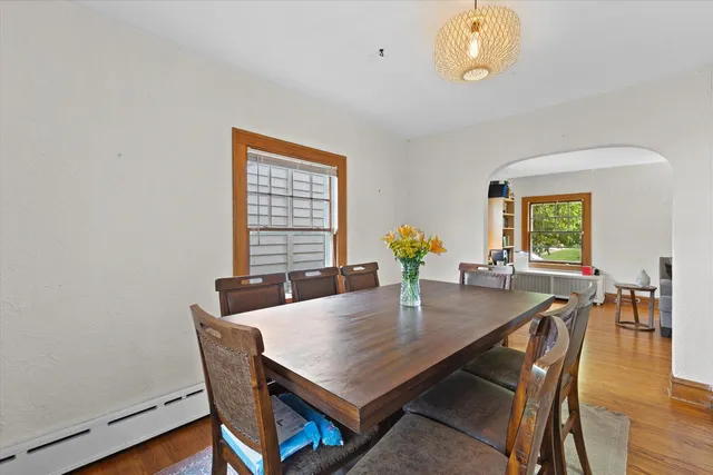 a dining room with furniture and window