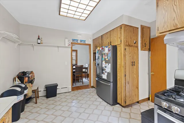 a view of a storage & utility room with two washing machine