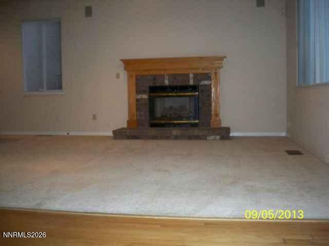 2249 Evans Creek Terrace Reno, NV 89519 - Photo 6 of 16 a view of empty room with a fireplace