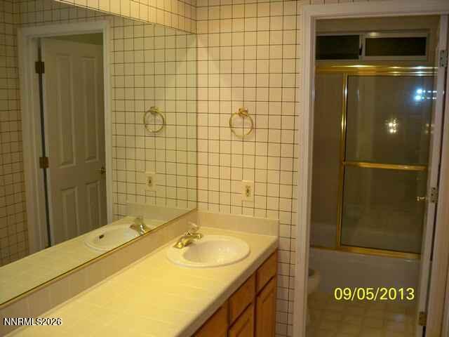 2249 Evans Creek Terrace Reno, NV 89519 - Photo 9 of 16 a bathroom with a sink and a shower