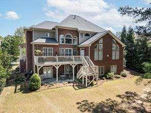 802 Pathview Court Dacula, GA 30019 - Photo 2 of 56 a view of a house with large windows