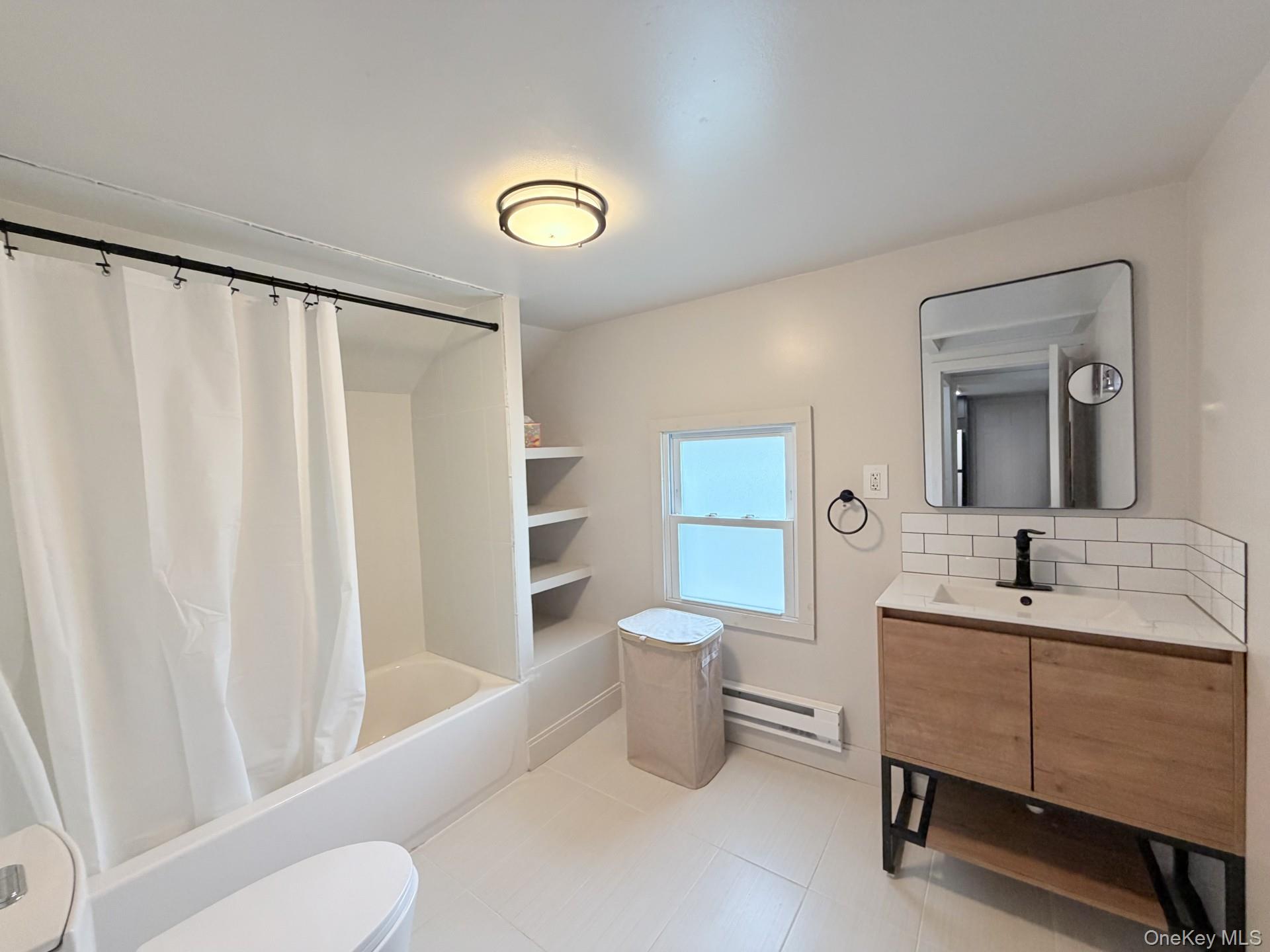 4 Lower Trinity Pass Road Pound Ridge, NY 10576 - Photo 25 of 29 a bathroom with a toilet sink and mirror