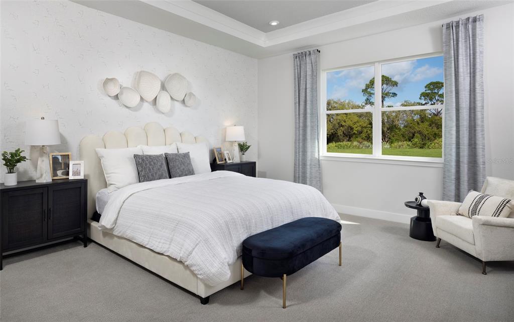 9014 Sundance Terrace Parrish, FL 34219 - Photo 7 of 19 a bedroom with a bed and a painting on the wall