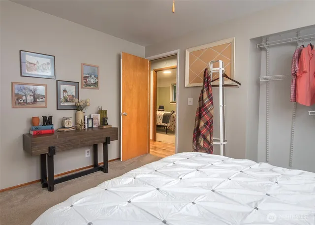 a bed room with a bed and a chandelier