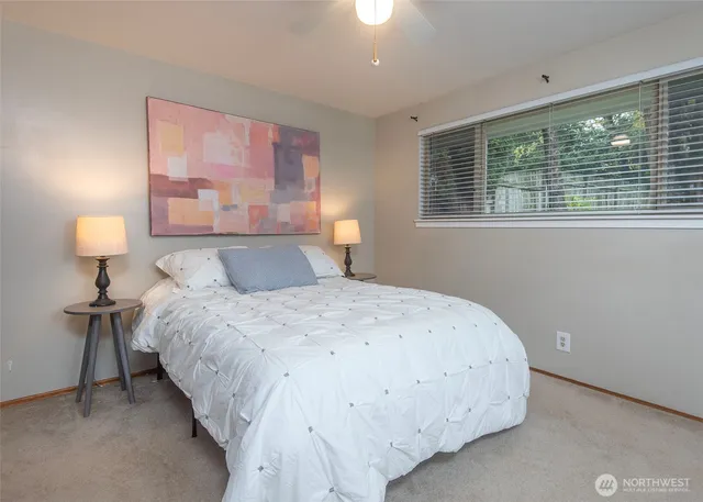 a bedroom with a bed and window