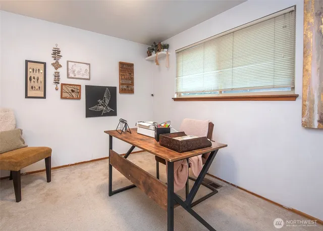 a view of a workspace with furniture